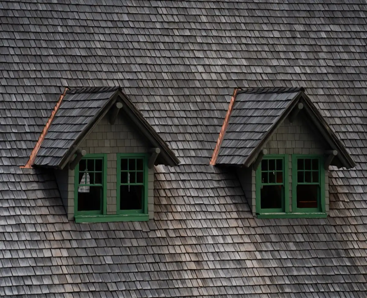 Dormers on a shingle roof in Amarillo, TX, where step flashing and kickout flashing carry water past the walls