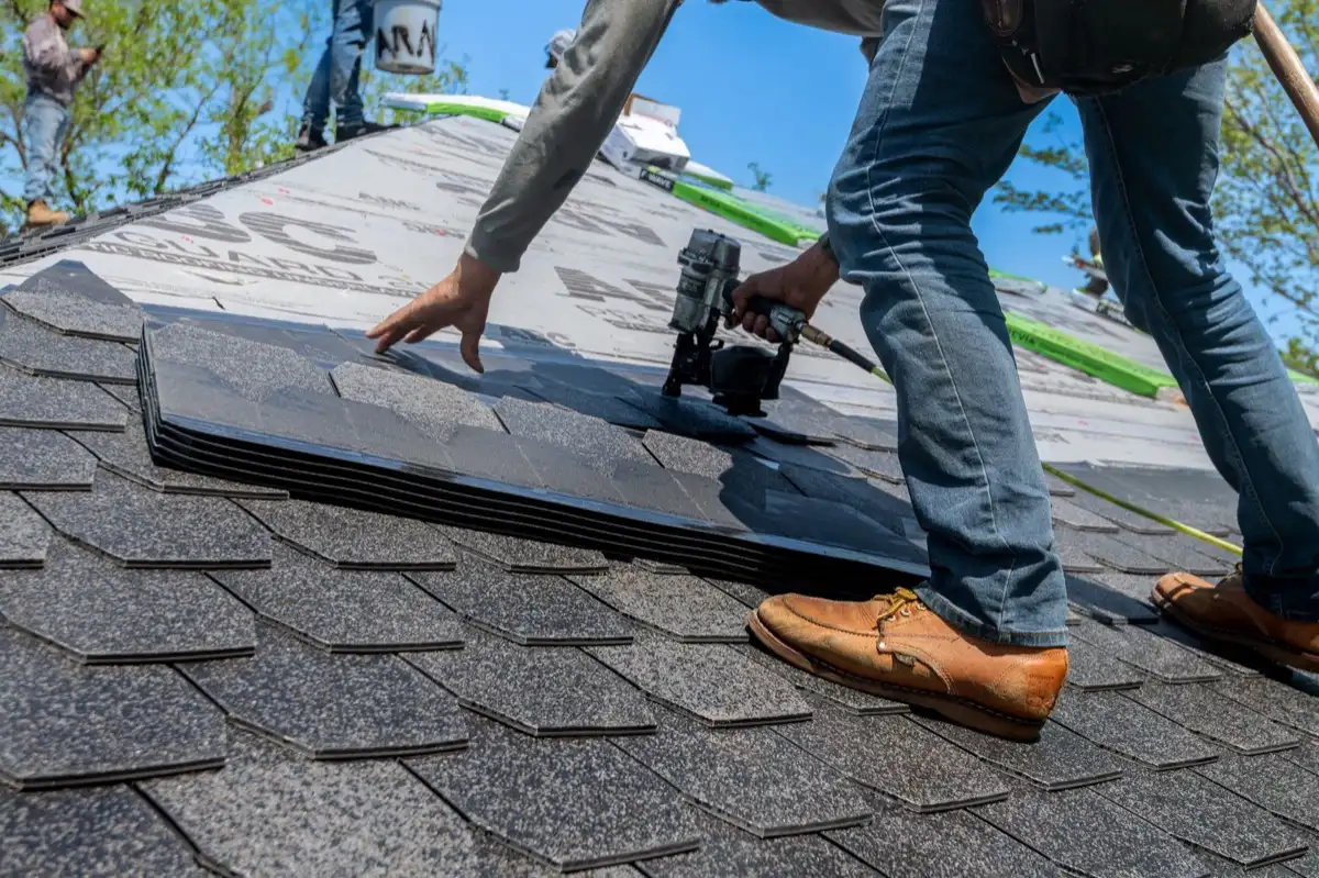 Inspecting an asphalt shingle slope after a hailstorm in Amarillo, TX